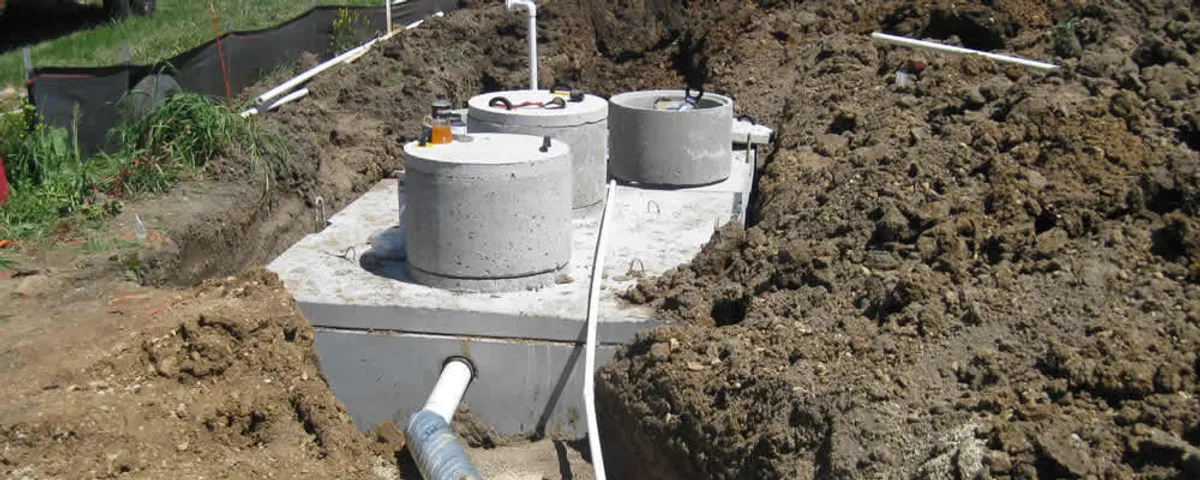 Septic system repair and installation site with tank access ports in Champaign, IL